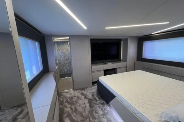 Luxurious cabin interior of the 72' Pershing yacht, featuring a spacious bed for comfort and relaxation.