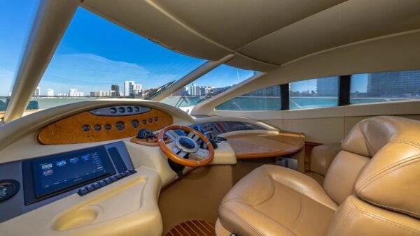 62' AZIMUT REGAL yacht's steering console, featuring advanced navigation technology for smooth sailing.