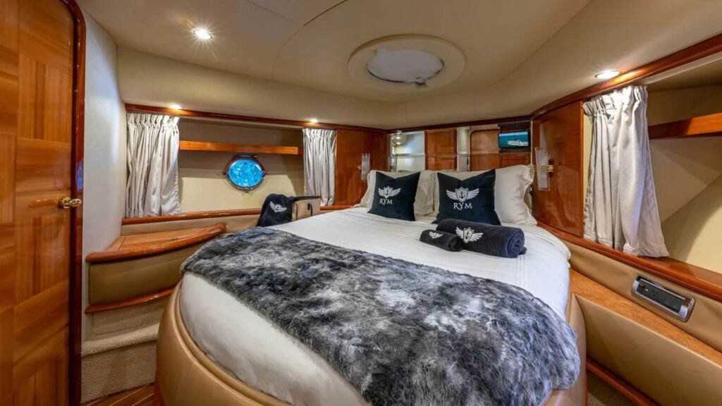 Master bedroom in the 62' AZIMUT REGAL yacht, offering a spacious and luxurious retreat.