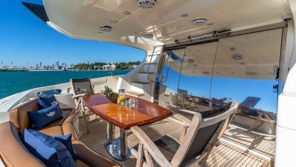 Outdoor dining area on the 62' AZIMUT REGAL yacht, perfect for enjoying meals and the sea breeze.