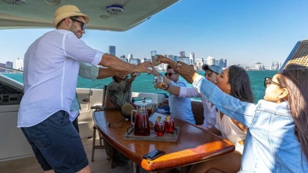 Guests celebrating on the deck of the 62' AZIMUT REGAL yacht, creating unforgettable memories.