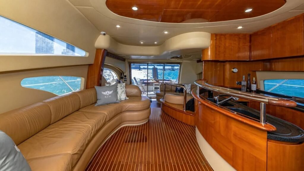 Interior lounge of the 62' AZIMUT REGAL yacht, featuring stylish and comfortable seating for relaxation.