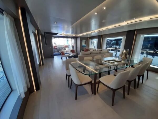 Dining area inside the 106' CUSTOM LINE yacht, designed for sophisticated meals.