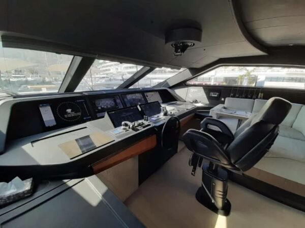 Helm station inside the 106' CUSTOM LINE yacht with state-of-the-art controls.