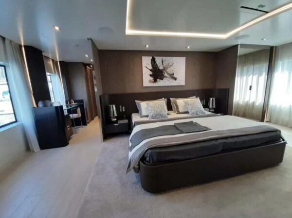 Master bedroom aboard the 106' CUSTOM LINE yacht, offering ultimate comfort and style.