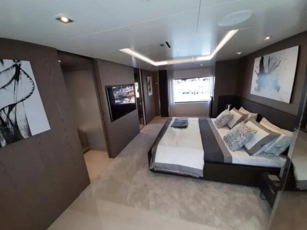 Another view of the master bedroom in the 106' CUSTOM LINE yacht with luxurious design.