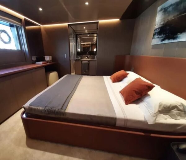 Guest bedroom on the 106' CUSTOM LINE yacht with elegant furnishings.