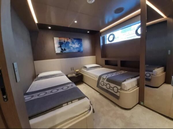 Another angle of the double bedroom aboard the 106' CUSTOM LINE yacht, emphasizing the luxury design.