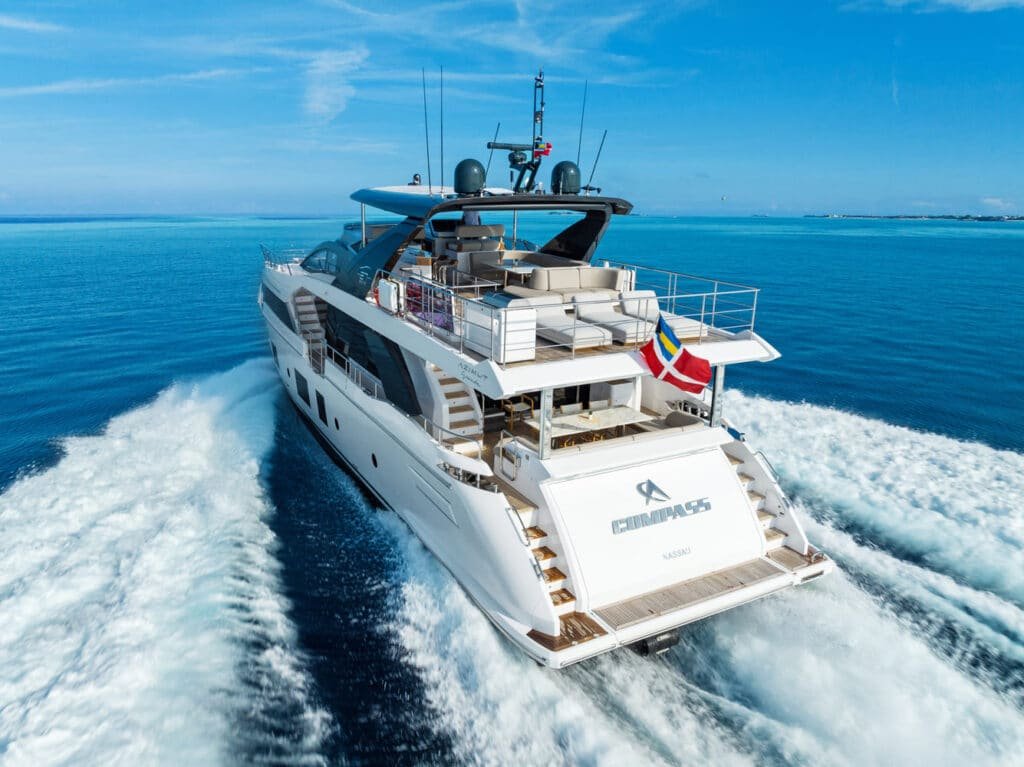 Rear view of the yacht, displaying its sophisticated design and powerful performance on the water