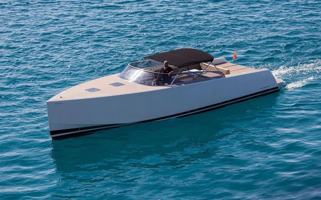 Sleek 40' Vandutch yacht cruising in Ibiza’s crystal-clear waters.