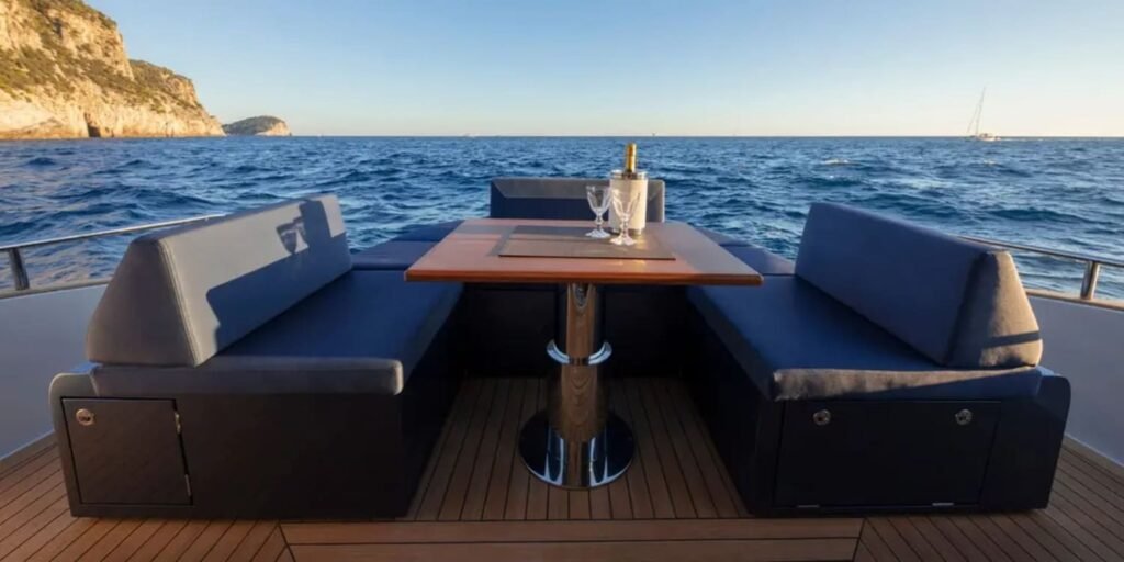 Cozy and elegant outdoor dining setup on the 48' Solaris yacht's aft deck.