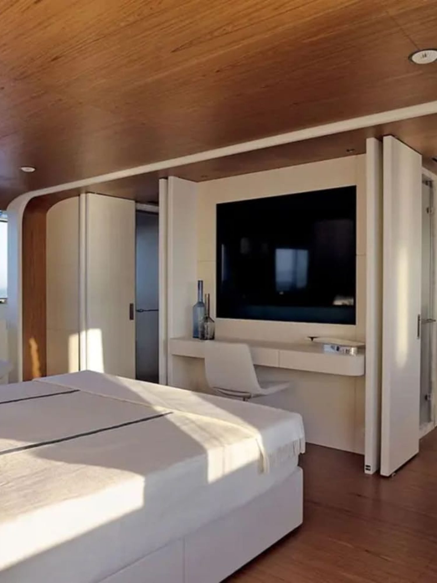 The master suite on the yacht, featuring refined décor and premium amenities.