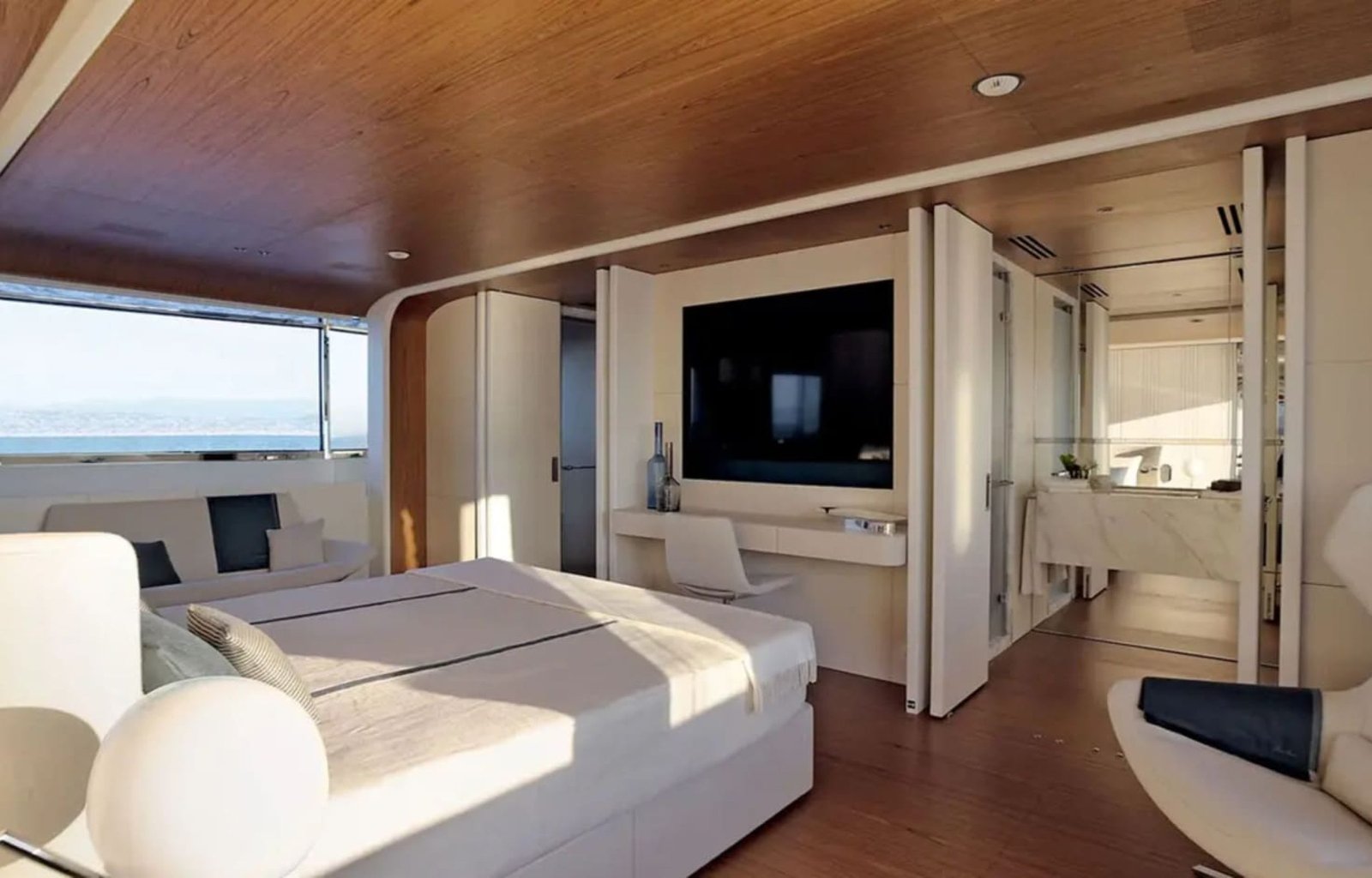 The master suite on the yacht, featuring refined décor and premium amenities.