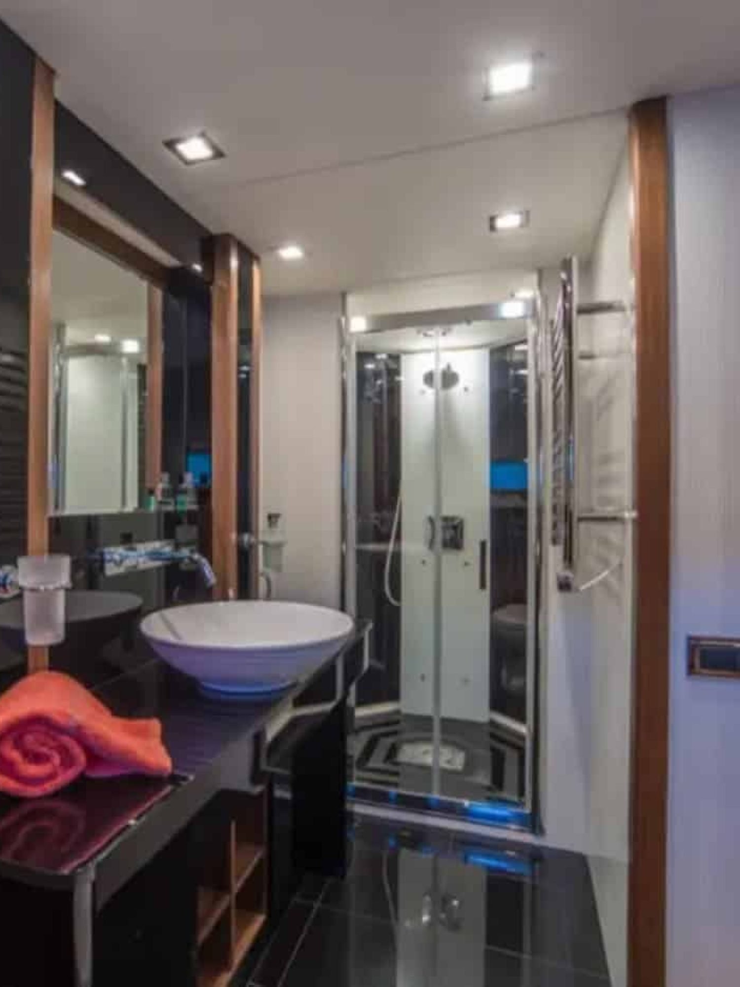 Modern en-suite bathroom inside the yacht, featuring premium finishes.