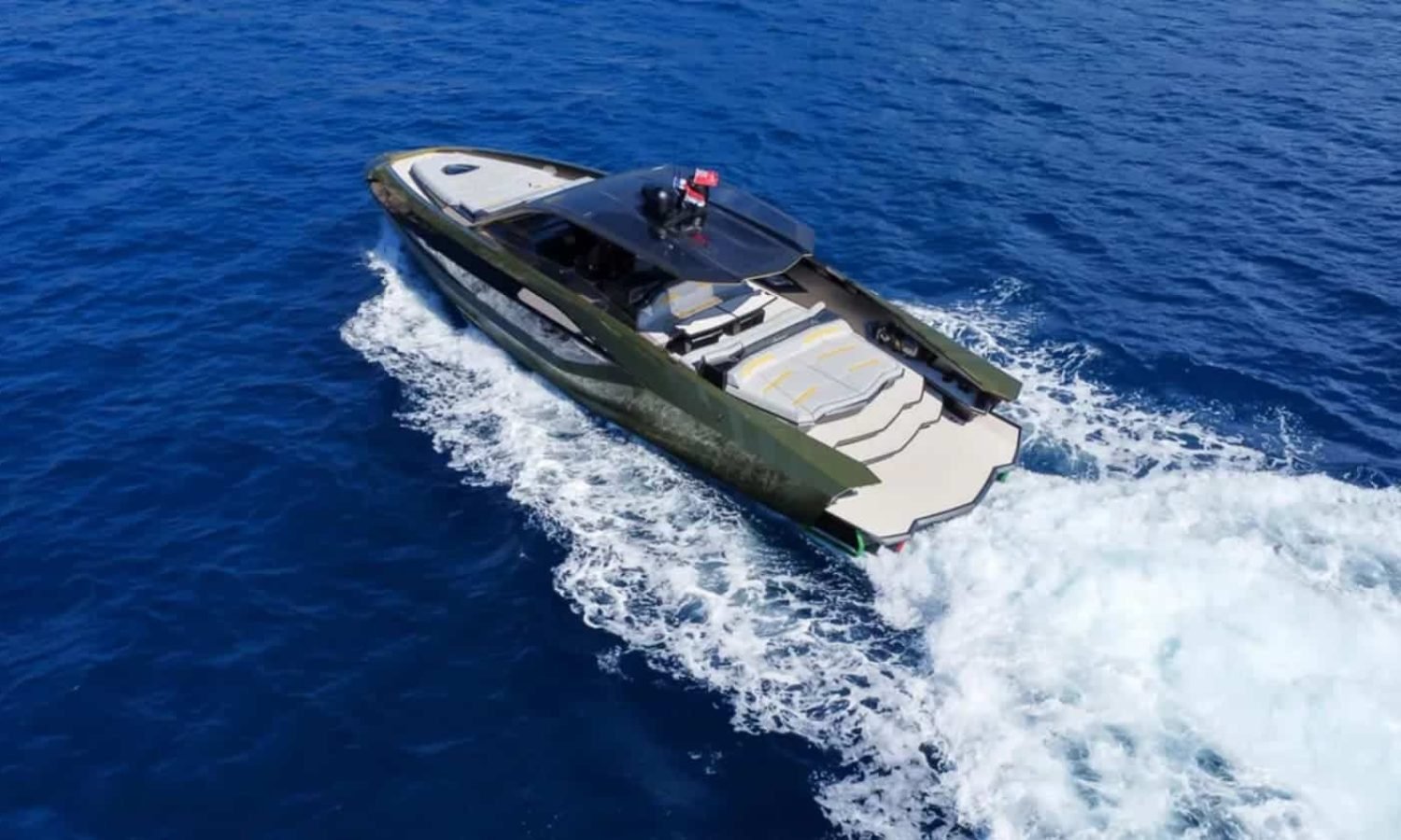 Side-angle view of the 63' Tecnomar Lamborghini yacht, highlighting its sharp lines and aggressive stance.