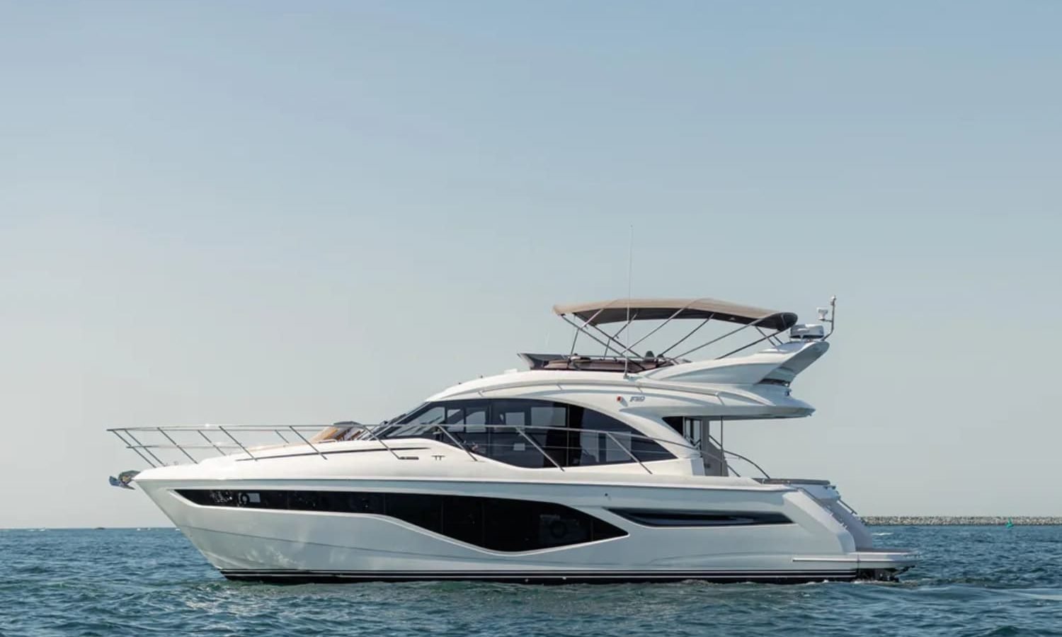 50' Princess yacht cruising on open waters, showcasing its sleek and modern design.