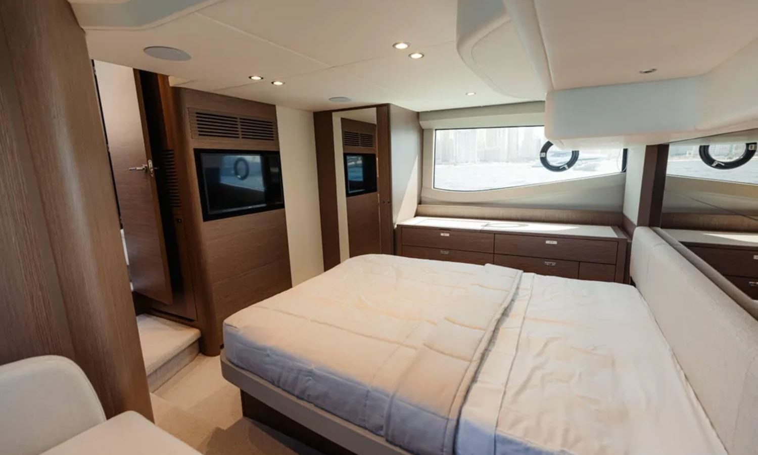 Elegant master suite on the yacht, featuring a spacious bed and high-end finishes
