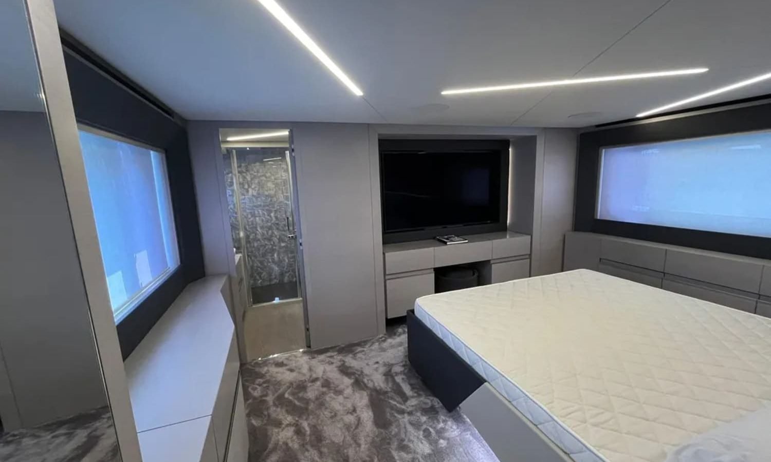 Luxurious cabin interior of the 72' Pershing yacht, featuring a spacious bed for comfort and relaxation.