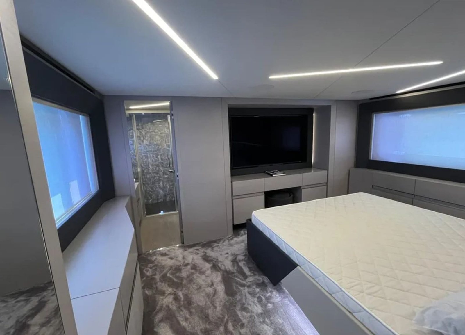 Luxurious cabin interior of the 72' Pershing yacht, featuring a spacious bed for comfort and relaxation.