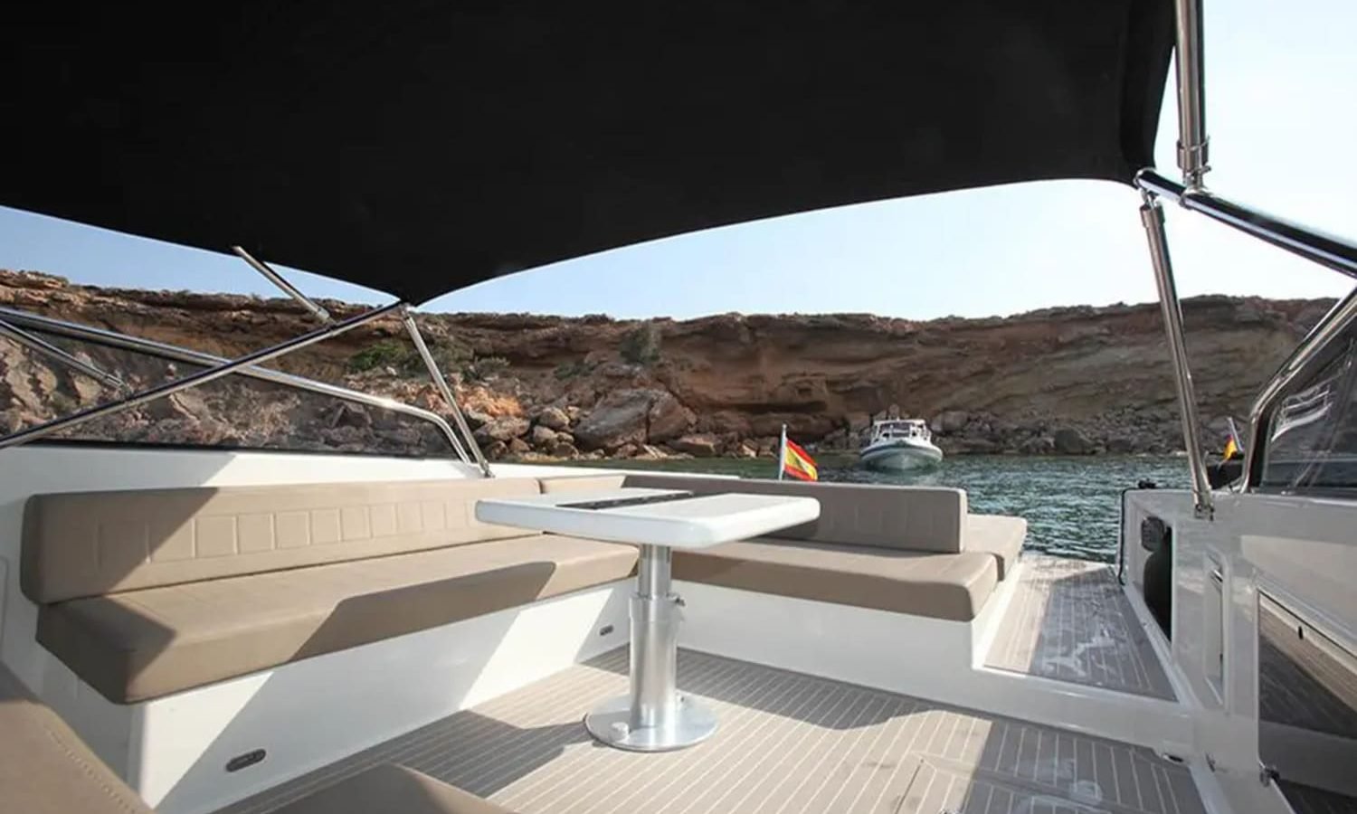 Ibiza 9 Stylish interior of the yacht with comfortable seating and a table.