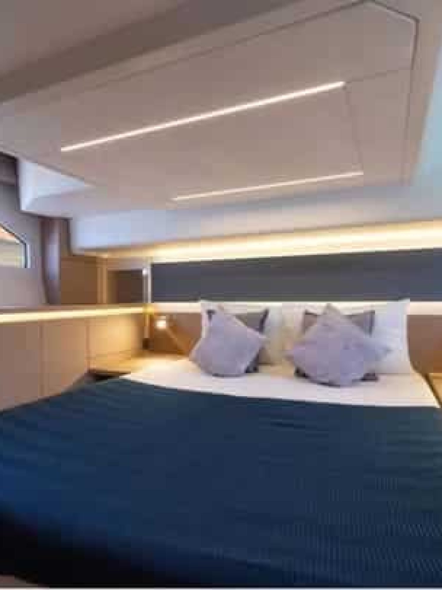 Cozy and stylish bedroom inside the 42' Prestige yacht, featuring premium bedding and modern design.