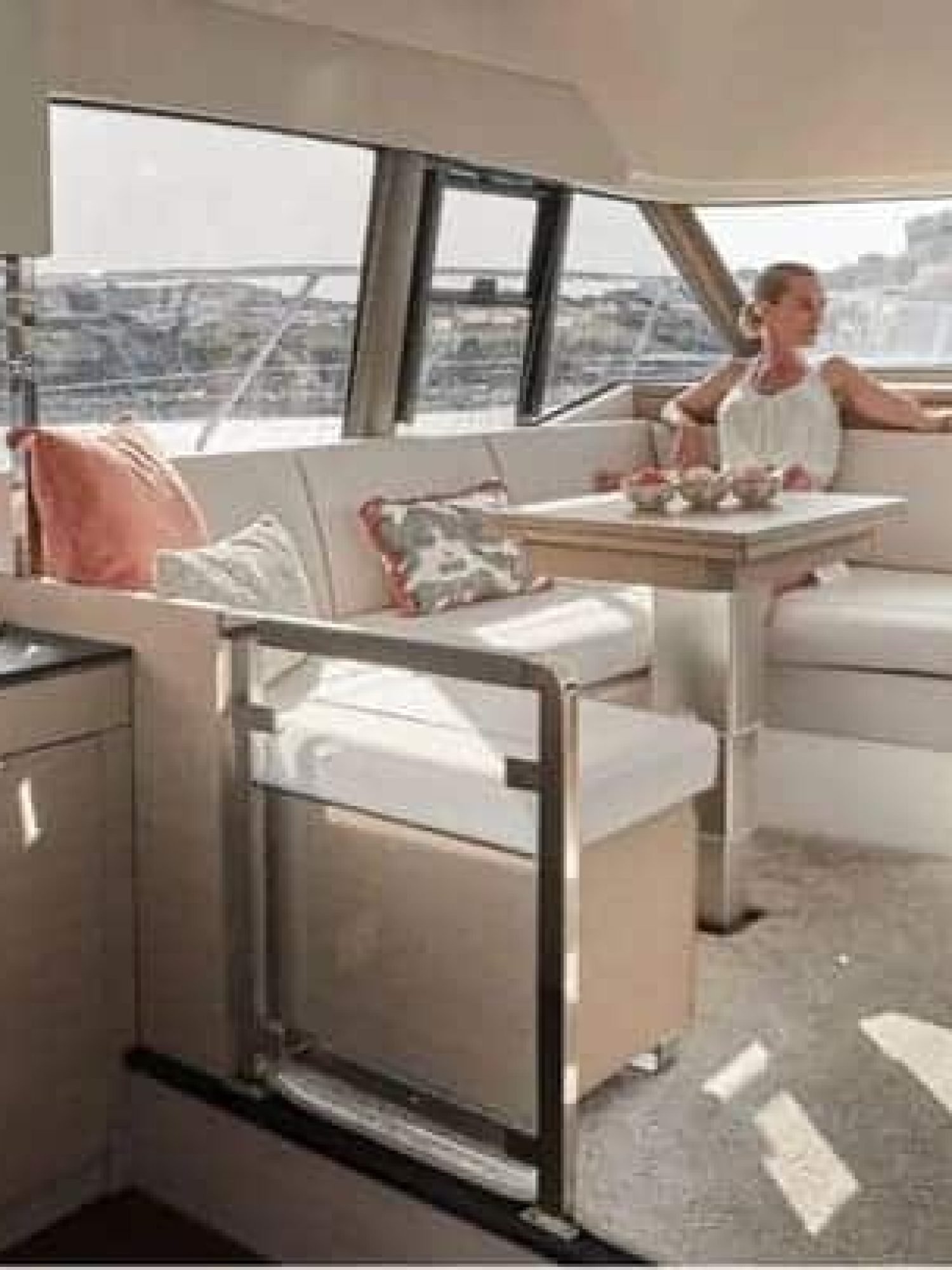 "Luxury dining area inside the 42' Prestige yacht, featuring a stylish table setup and premium finishes.