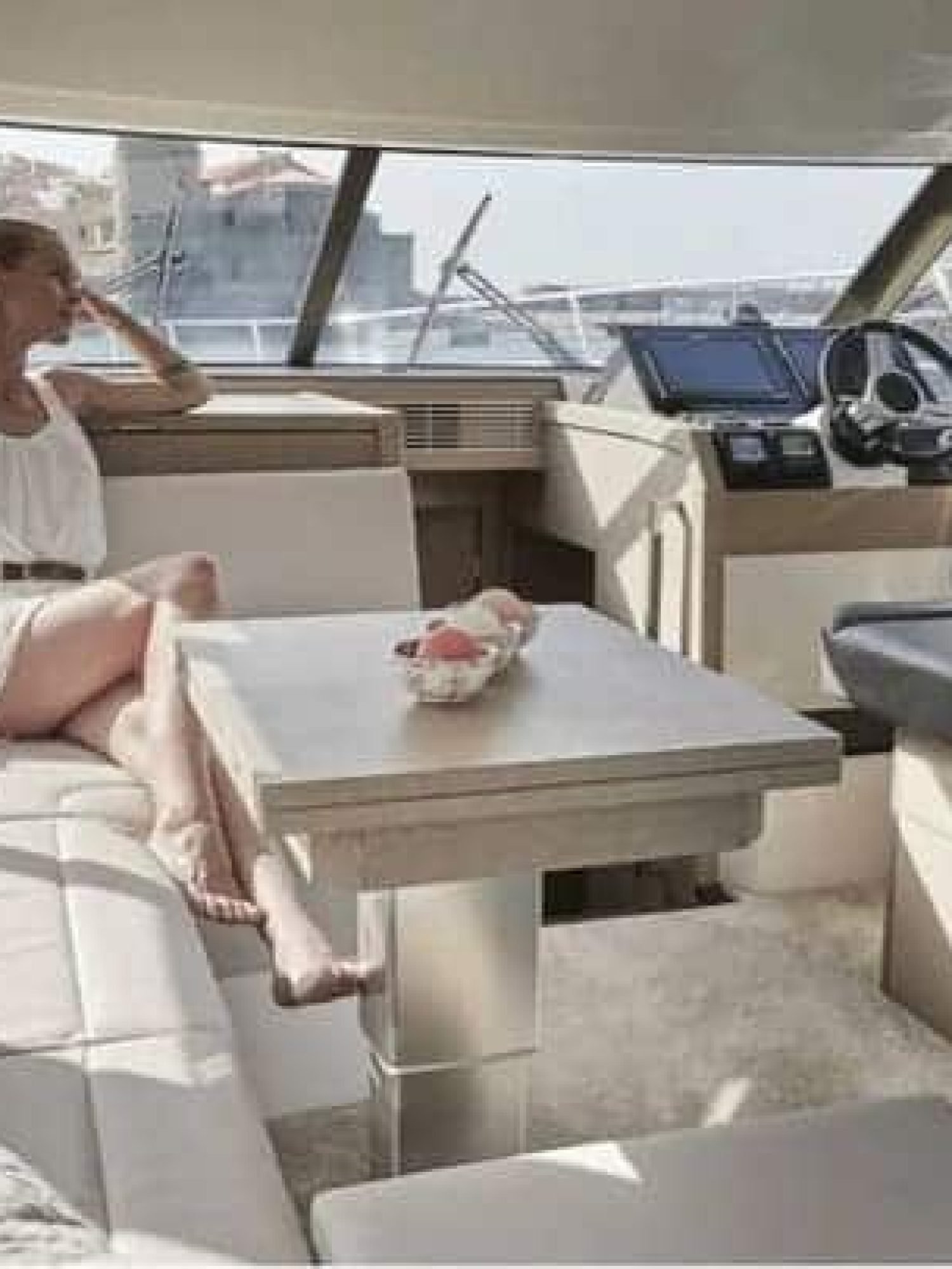 Another perspective of the dining area inside the 42' Prestige yacht, showcasing spacious elegance.