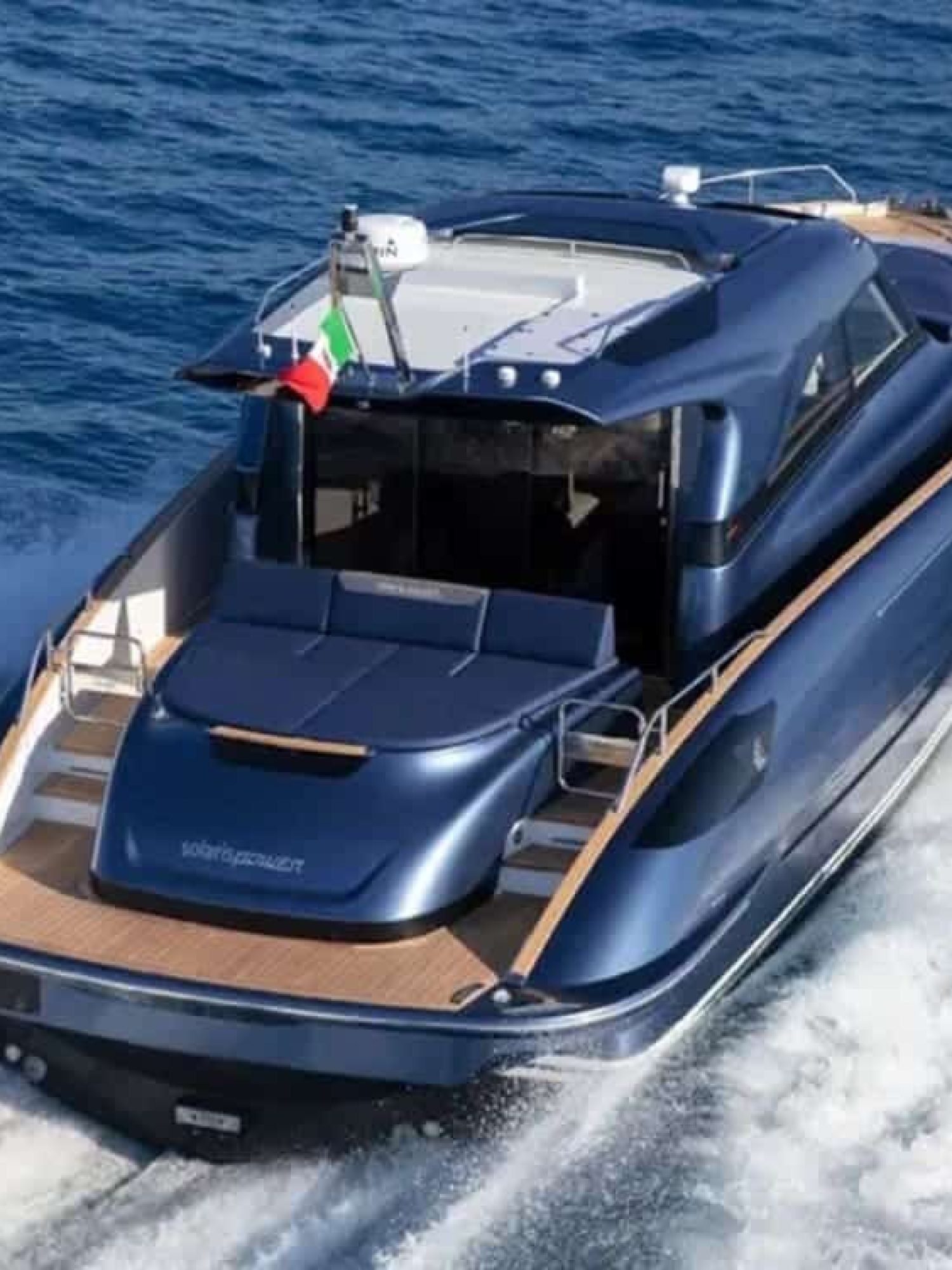Rear angle of the yacht, emphasizing its spacious outdoor areas and luxurious features.