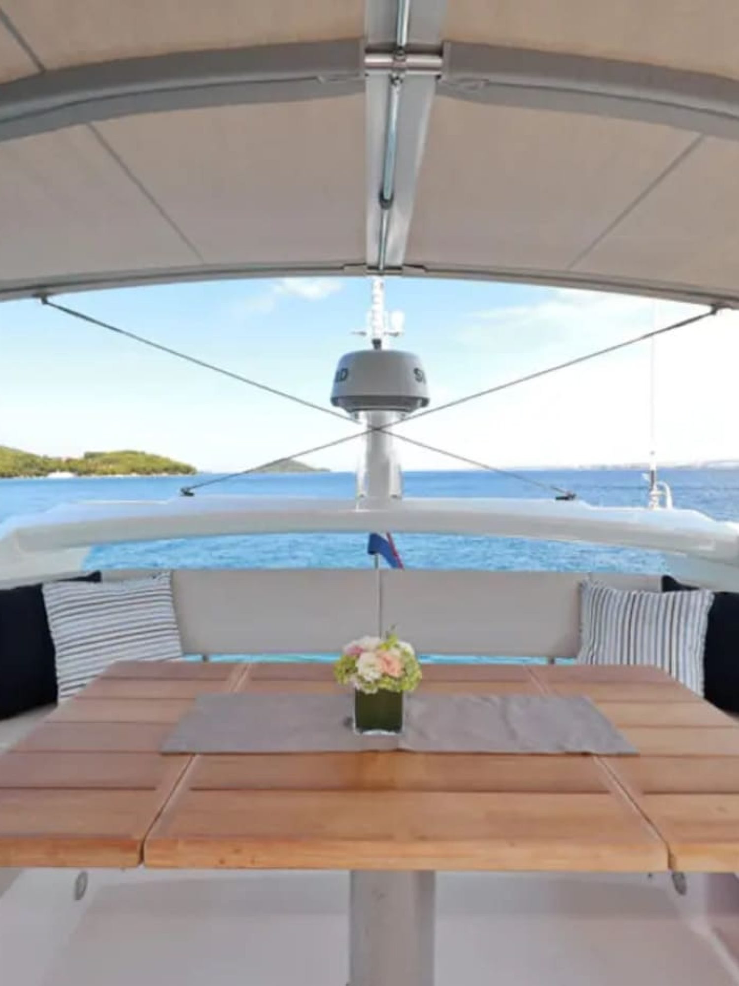 Outdoor dining space with sofas on the 56' Sunseeker Manhattan yacht