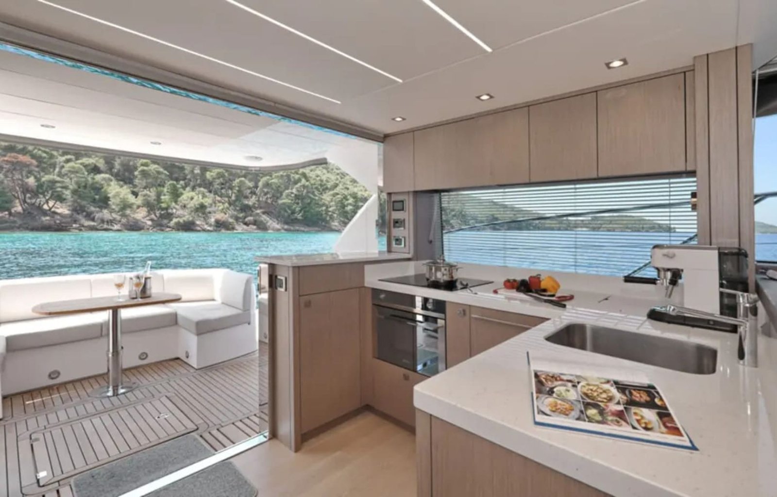Modern kitchen with appliances inside the yacht