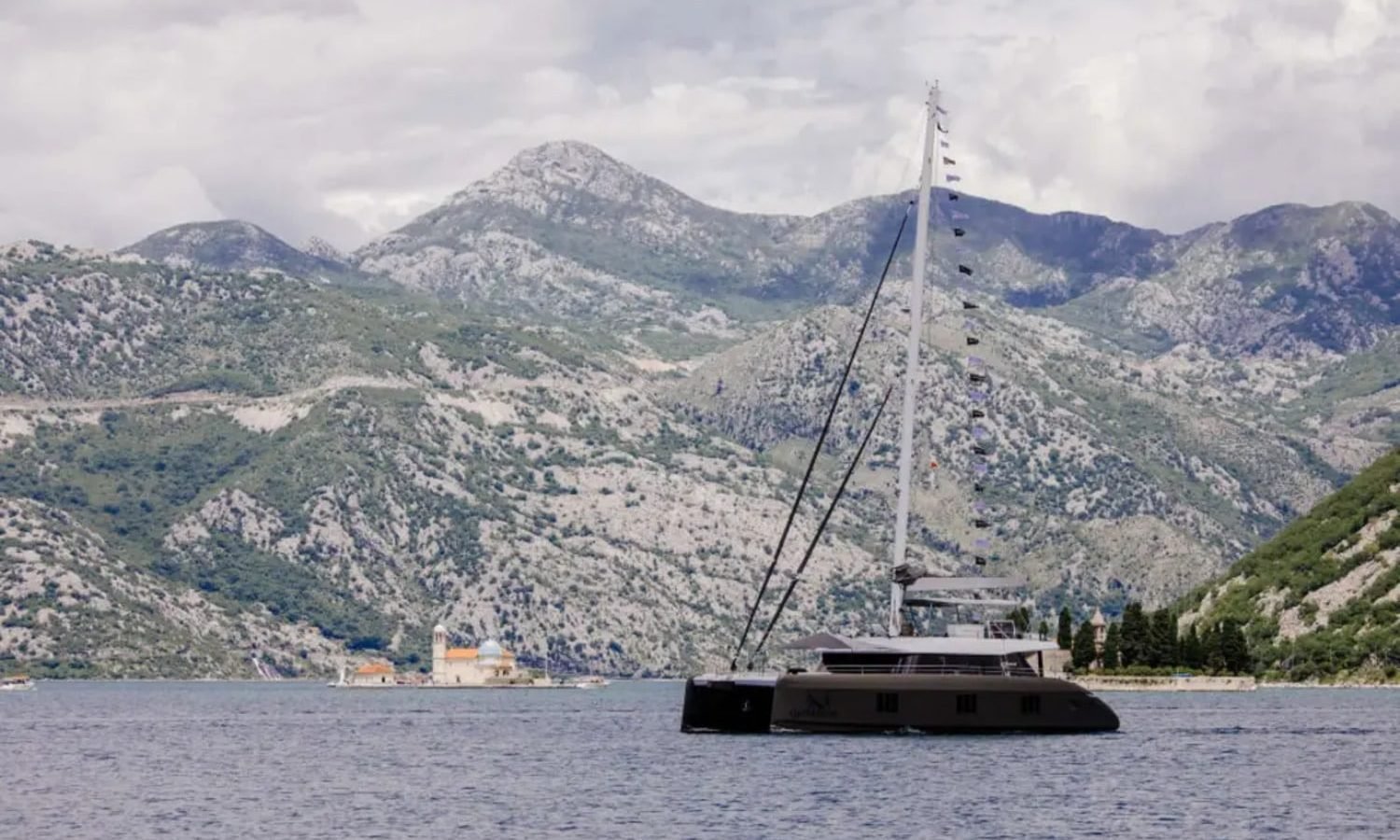 Croatia 10 A luxurious Sunreef 60 yacht sailing at sunset, showcasing elegance and sophistication.