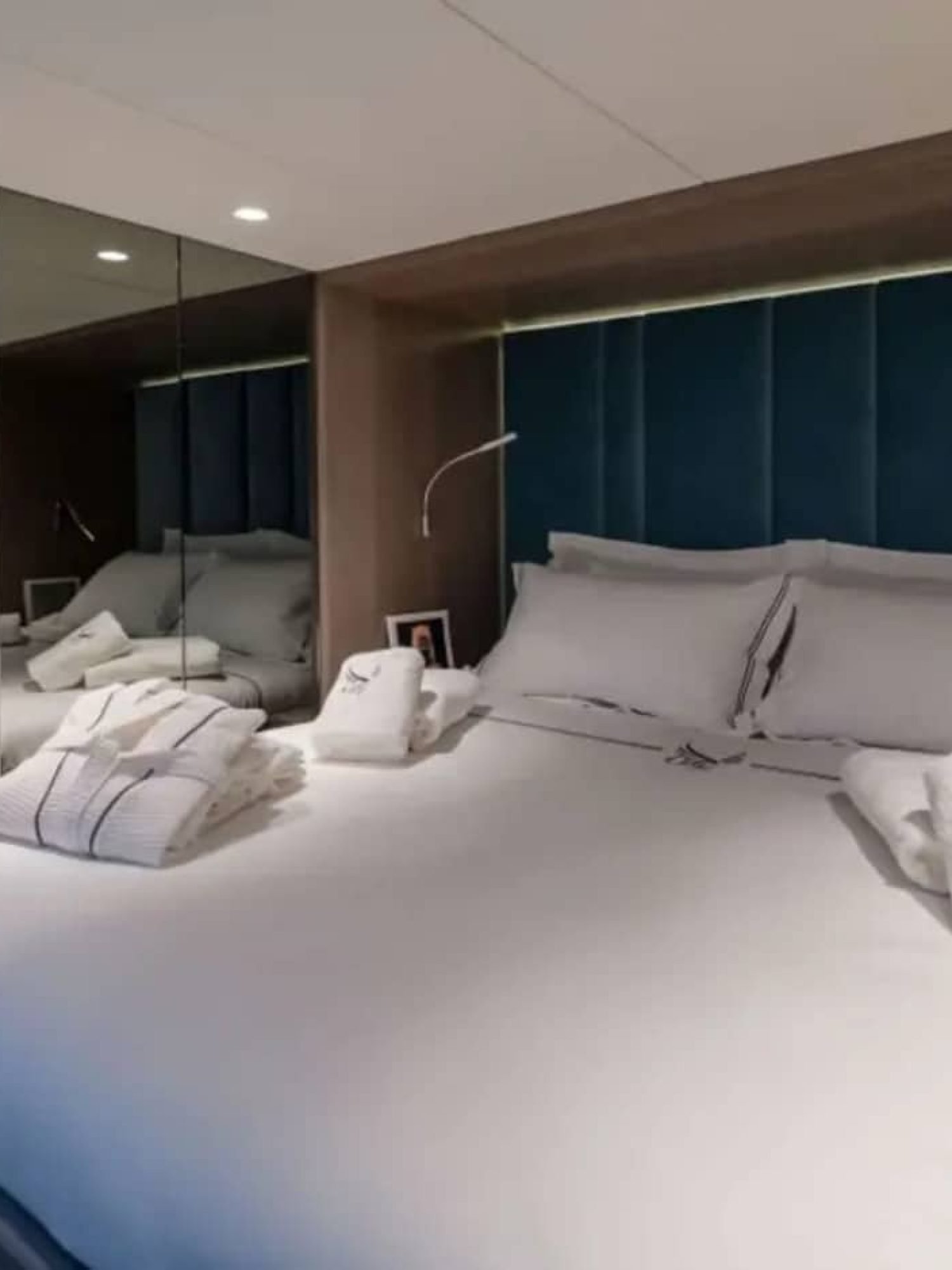 A different perspective of the master bedroom on the yacht, showcasing its spacious layout.