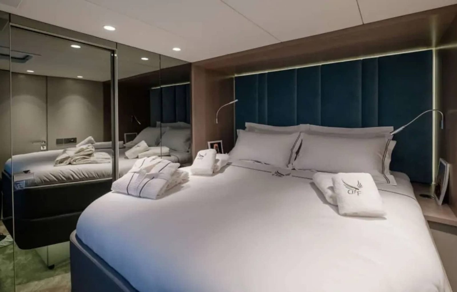 A different perspective of the master bedroom on the yacht, showcasing its spacious layout.