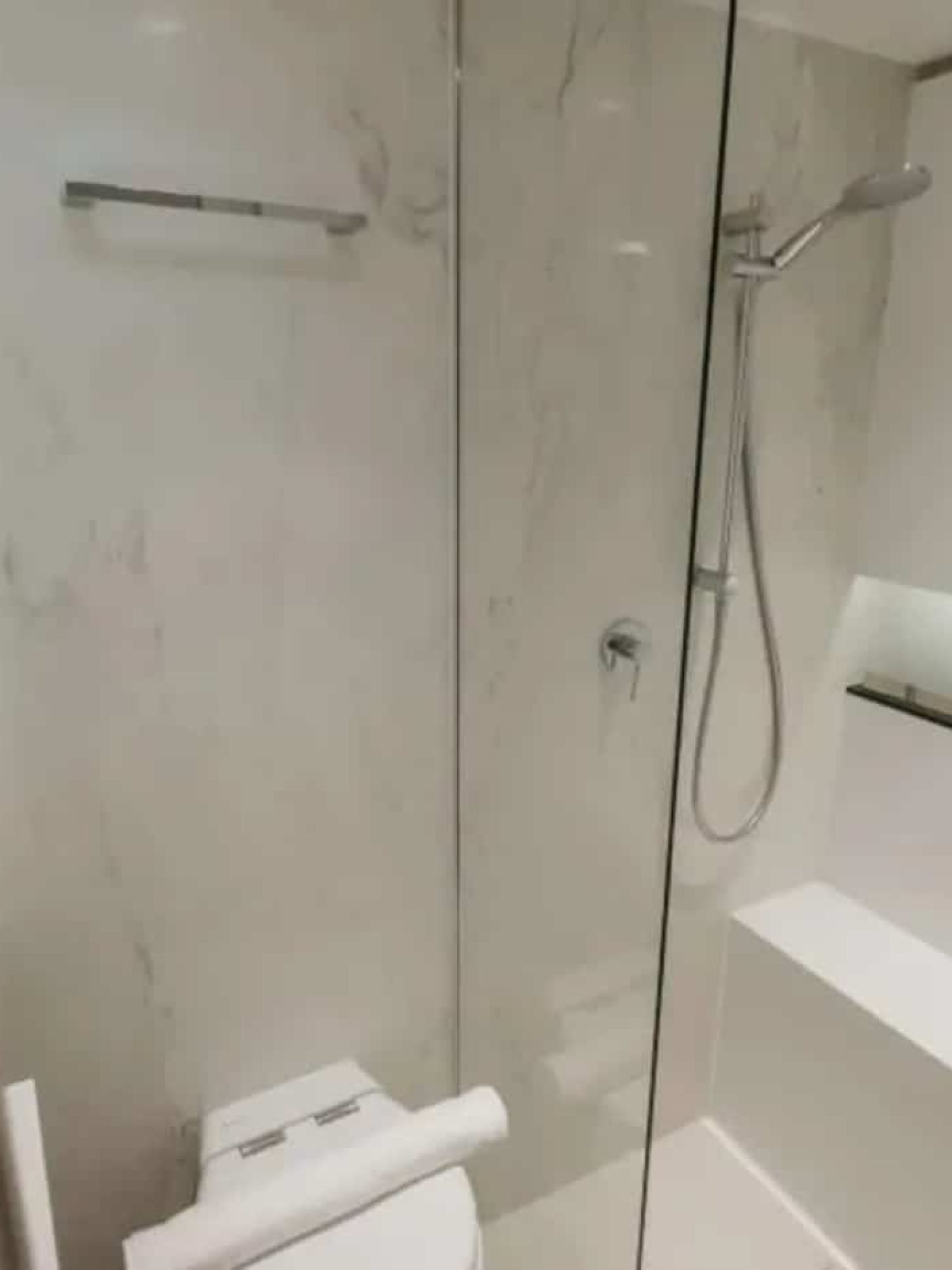 A luxurious en-suite bathroom on the Sunreef 60 yacht, featuring high-end finishes and modern amenities.