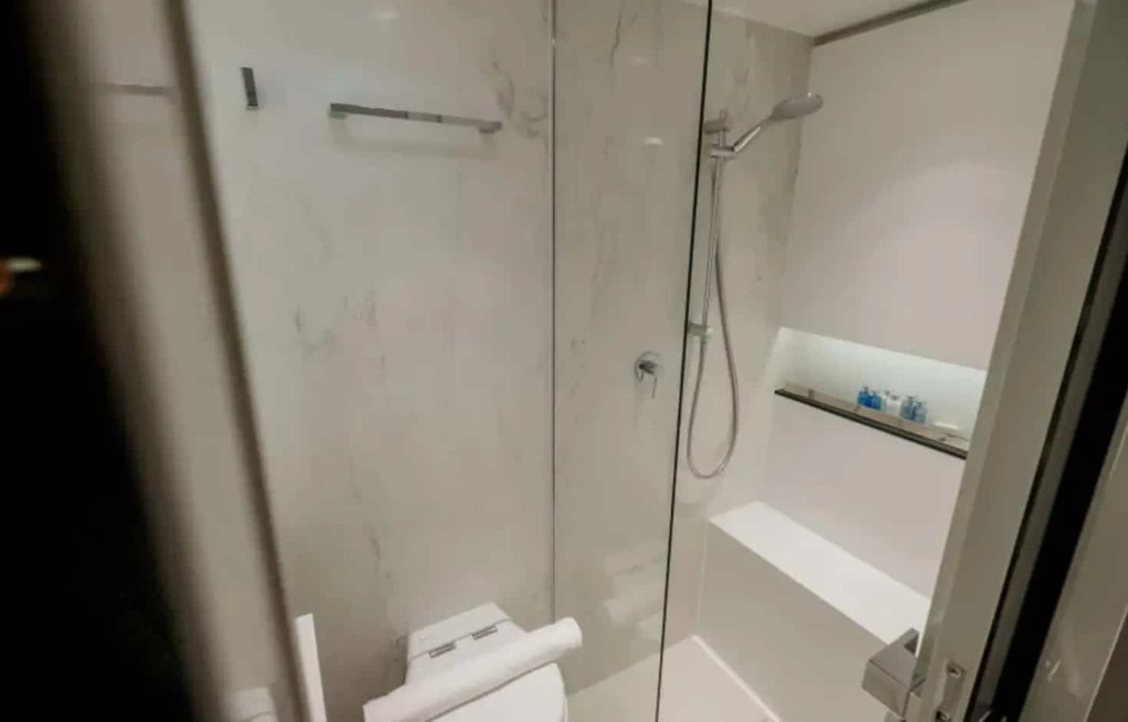 A luxurious en-suite bathroom on the Sunreef 60 yacht, featuring high-end finishes and modern amenities.