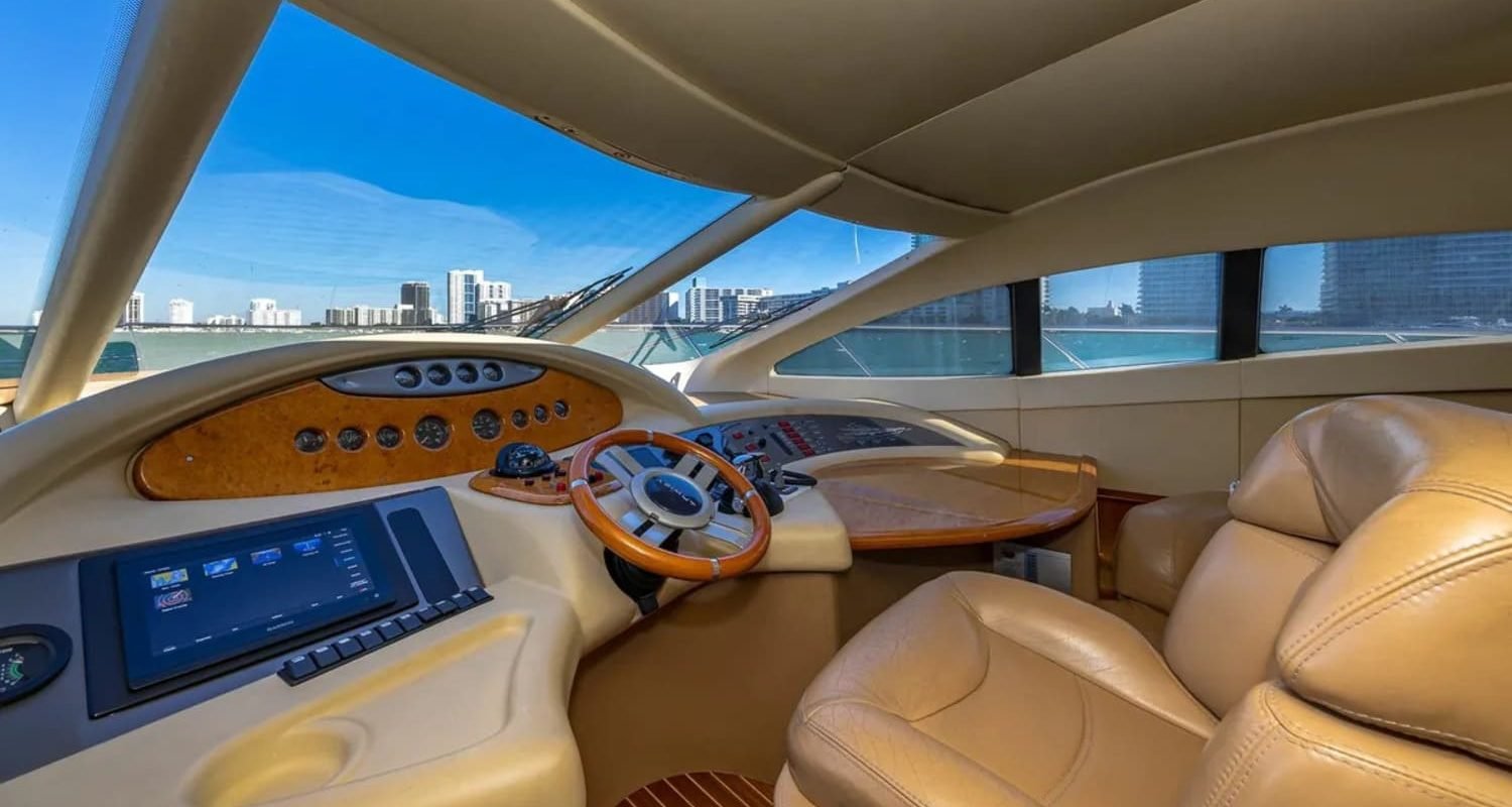 62' AZIMUT REGAL yacht's steering console, featuring advanced navigation technology for smooth sailing.