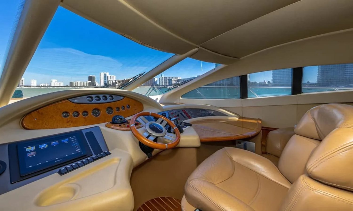 62' AZIMUT REGAL yacht's steering console, featuring advanced navigation technology for smooth sailing.