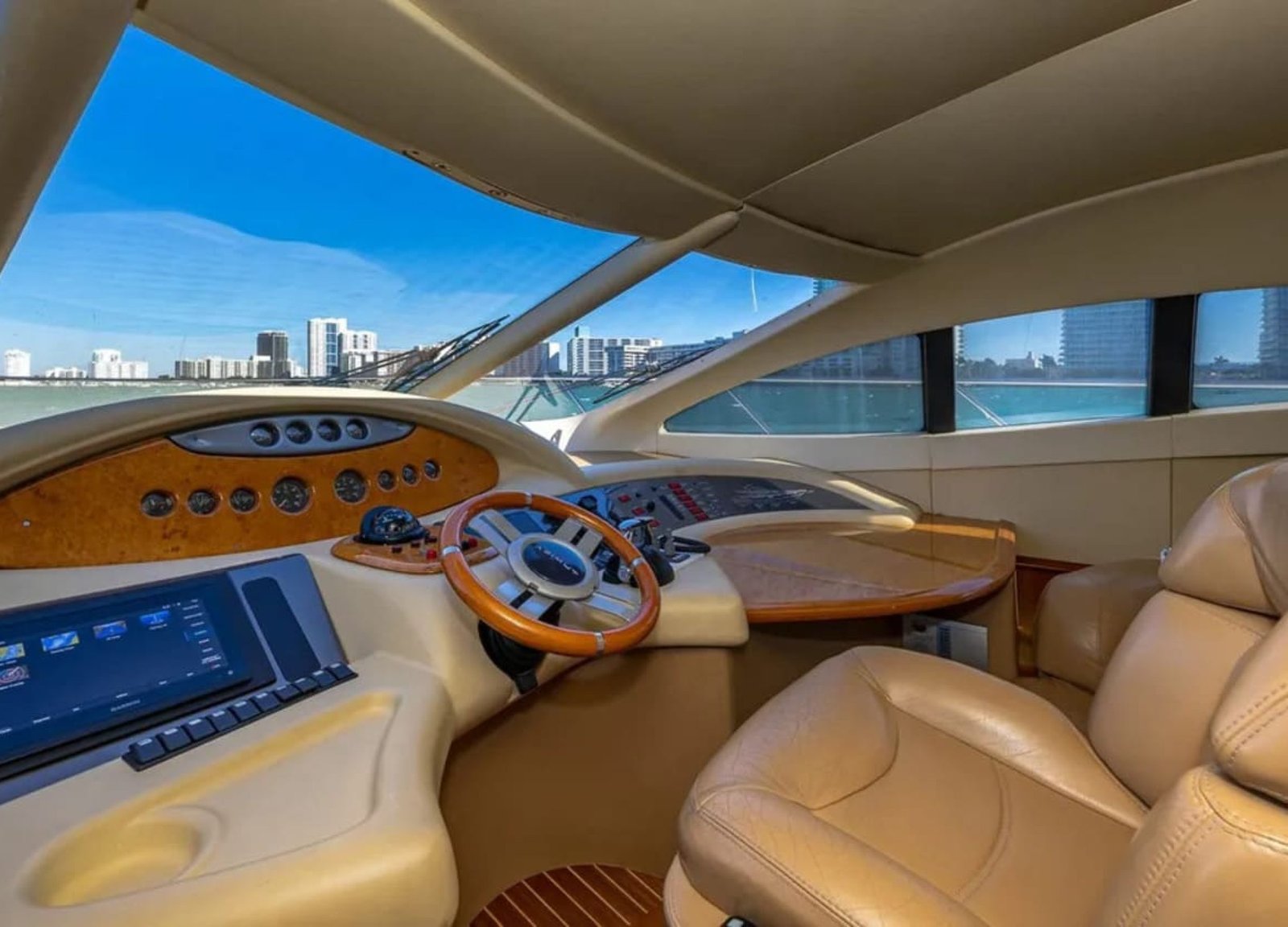 62' AZIMUT REGAL yacht's steering console, featuring advanced navigation technology for smooth sailing.