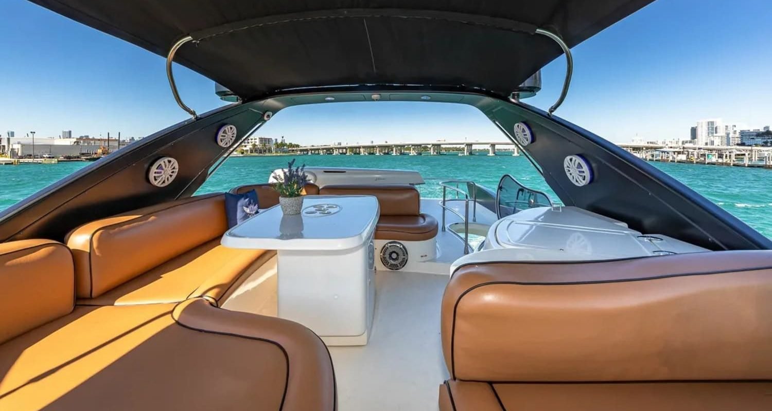 Interior seating area aboard the 62' AZIMUT REGAL yacht, designed for luxury and relaxation.