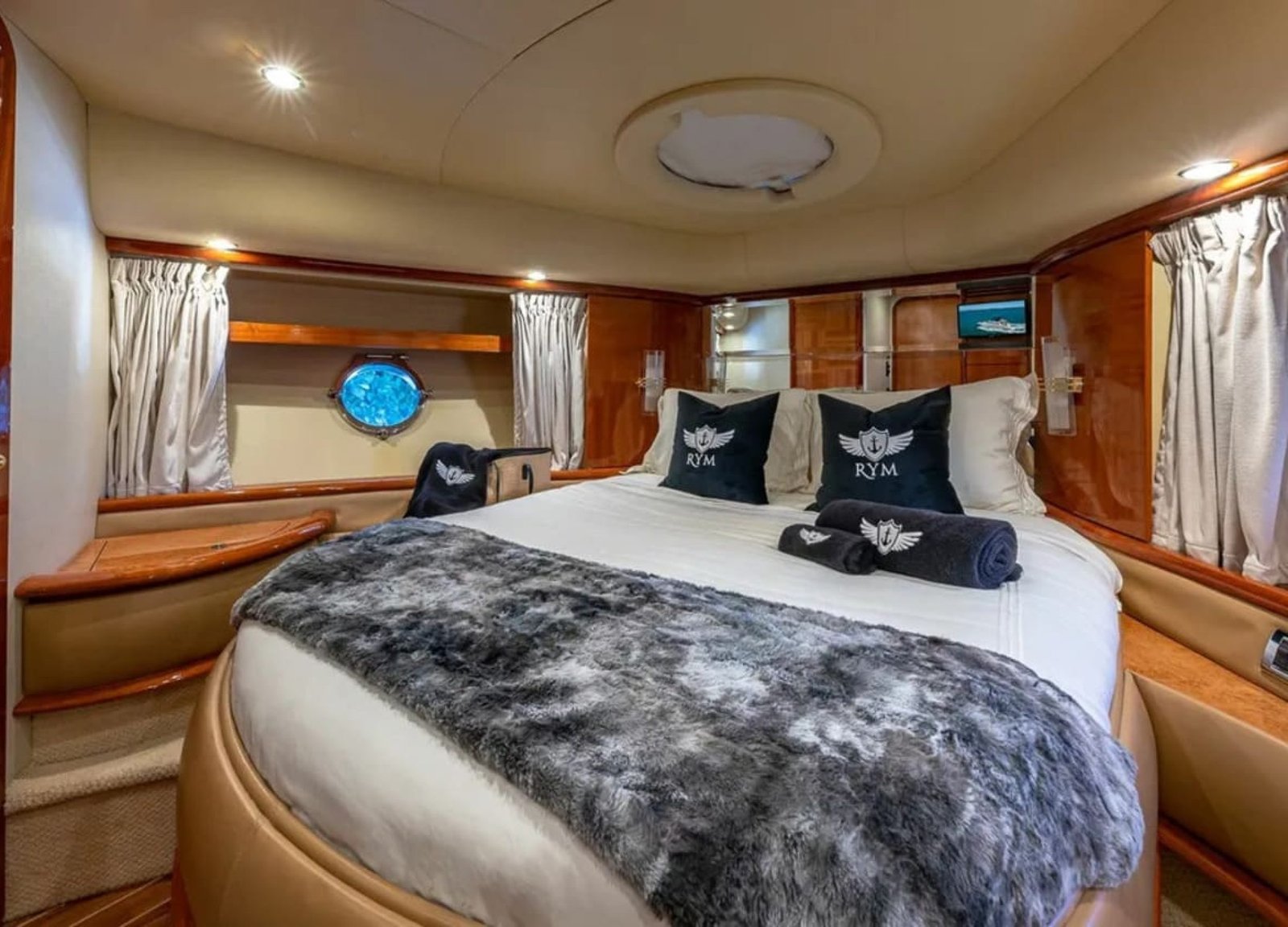 Master bedroom in the 62' AZIMUT REGAL yacht, offering a spacious and luxurious retreat.