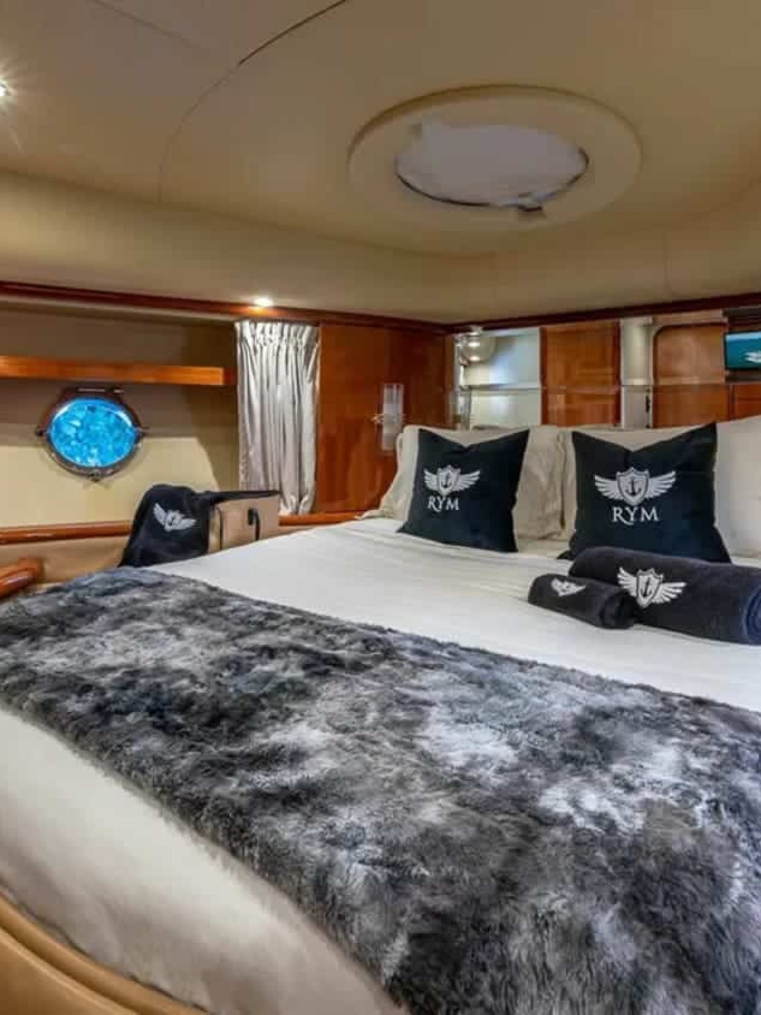 Master bedroom in the 62' AZIMUT REGAL yacht, offering a spacious and luxurious retreat.