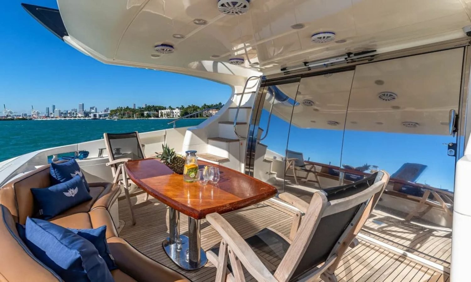 Outdoor dining area on the 62' AZIMUT REGAL yacht, perfect for enjoying meals and the sea breeze.