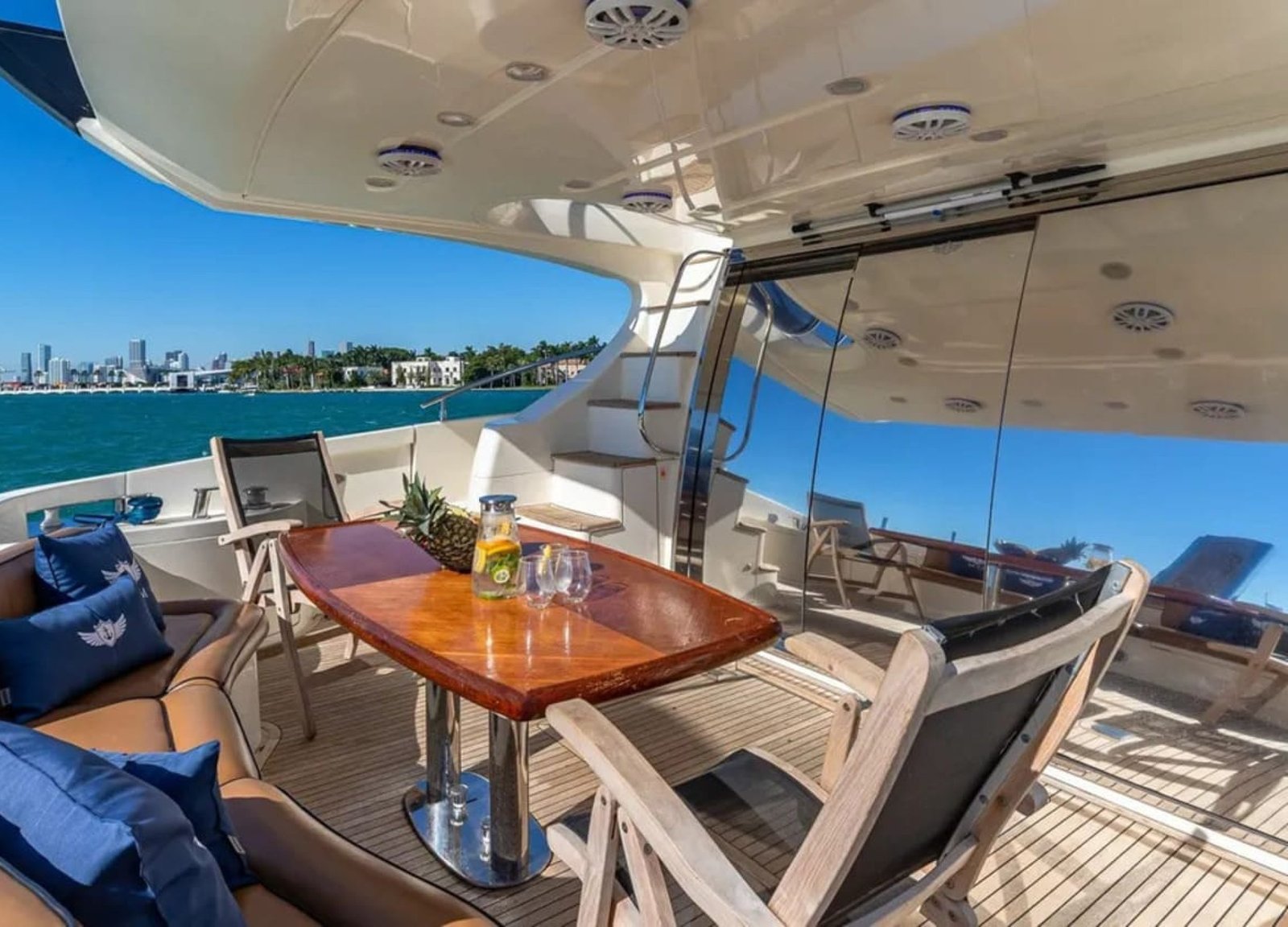 Outdoor dining area on the 62' AZIMUT REGAL yacht, perfect for enjoying meals and the sea breeze.