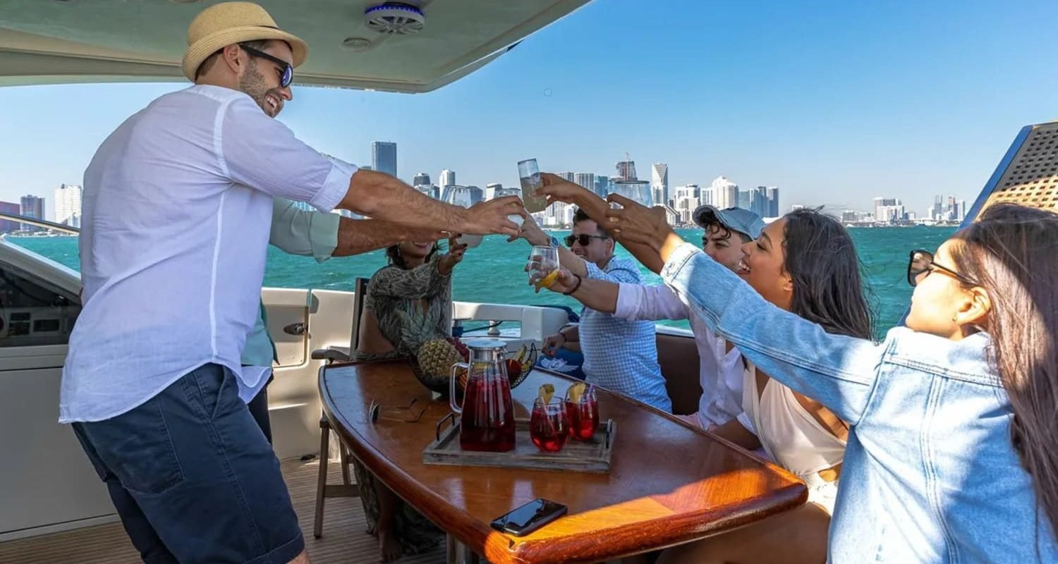 Guests celebrating on the deck of the 62' AZIMUT REGAL yacht, creating unforgettable memories.