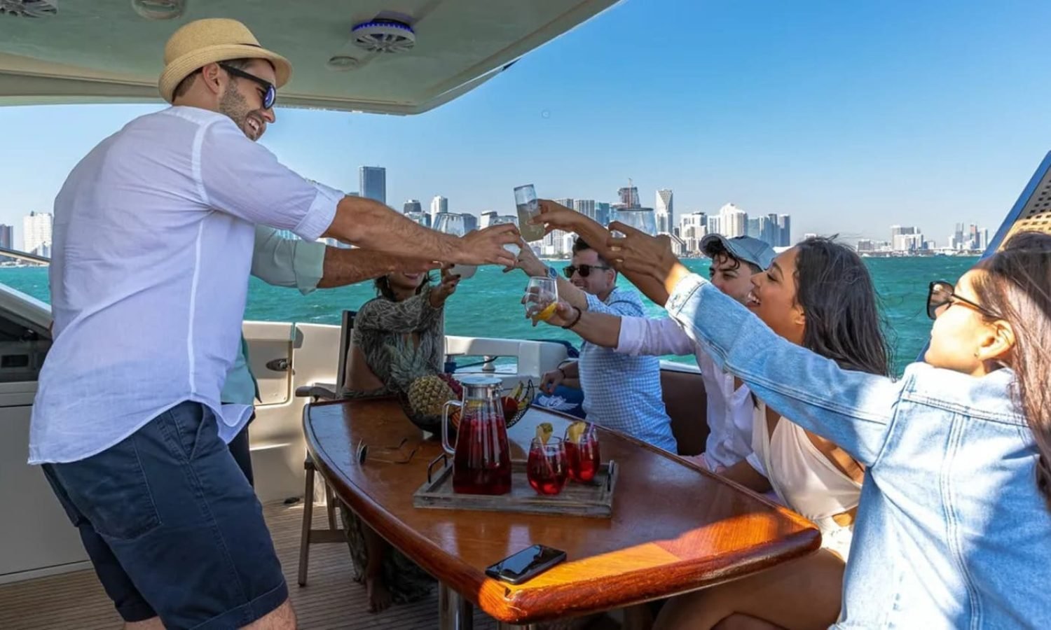 Guests celebrating on the deck of the 62' AZIMUT REGAL yacht, creating unforgettable memories.