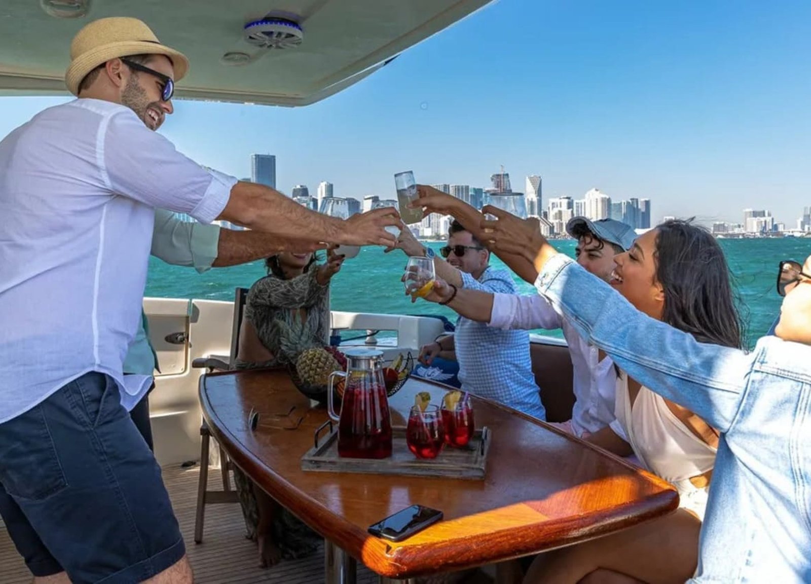 Guests celebrating on the deck of the 62' AZIMUT REGAL yacht, creating unforgettable memories.