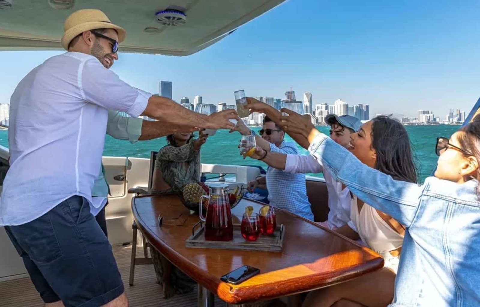 Guests celebrating on the deck of the 62' AZIMUT REGAL yacht, creating unforgettable memories.