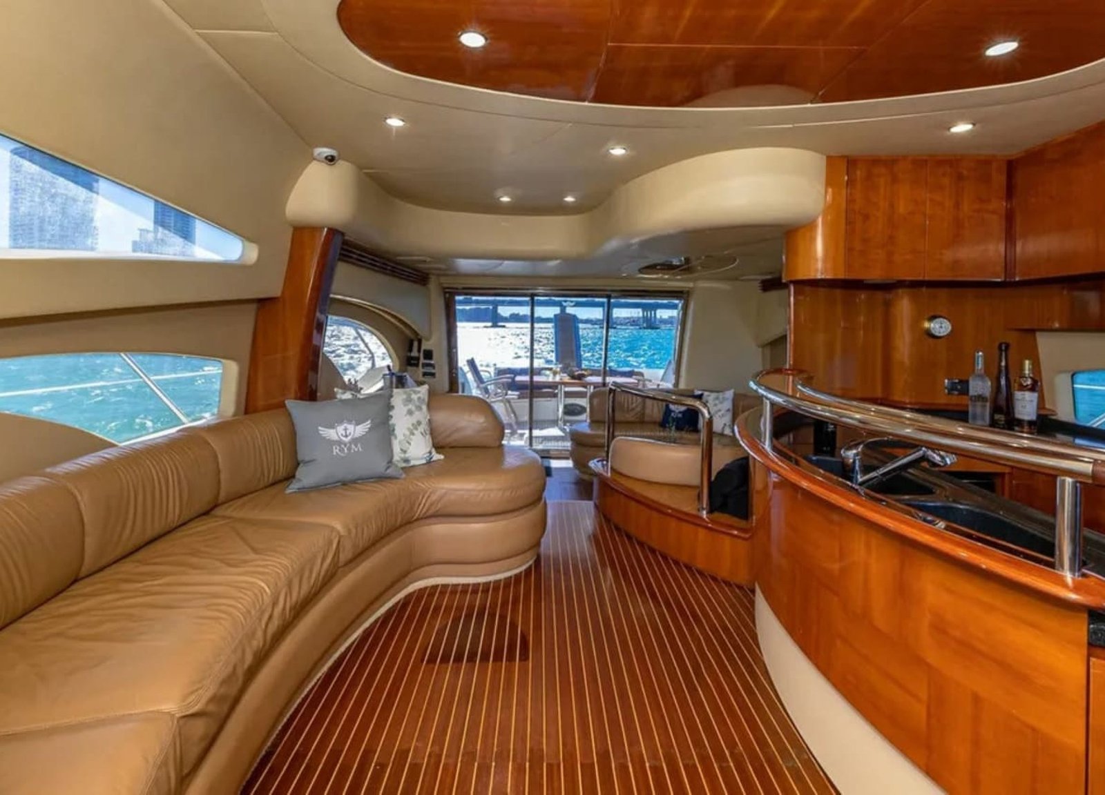 Interior lounge of the 62' AZIMUT REGAL yacht, featuring stylish and comfortable seating for relaxation.