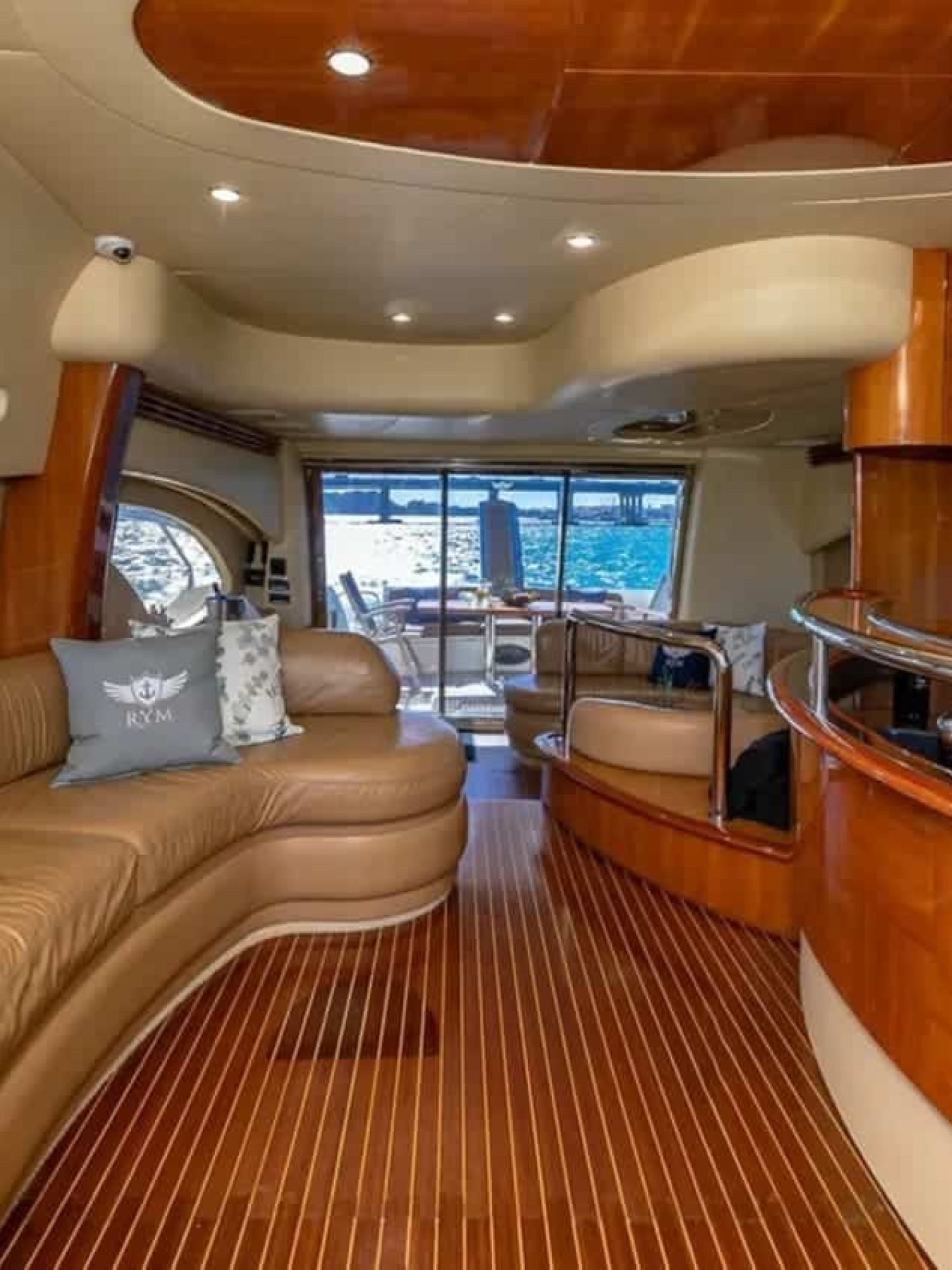 Interior lounge of the 62' AZIMUT REGAL yacht, featuring stylish and comfortable seating for relaxation.