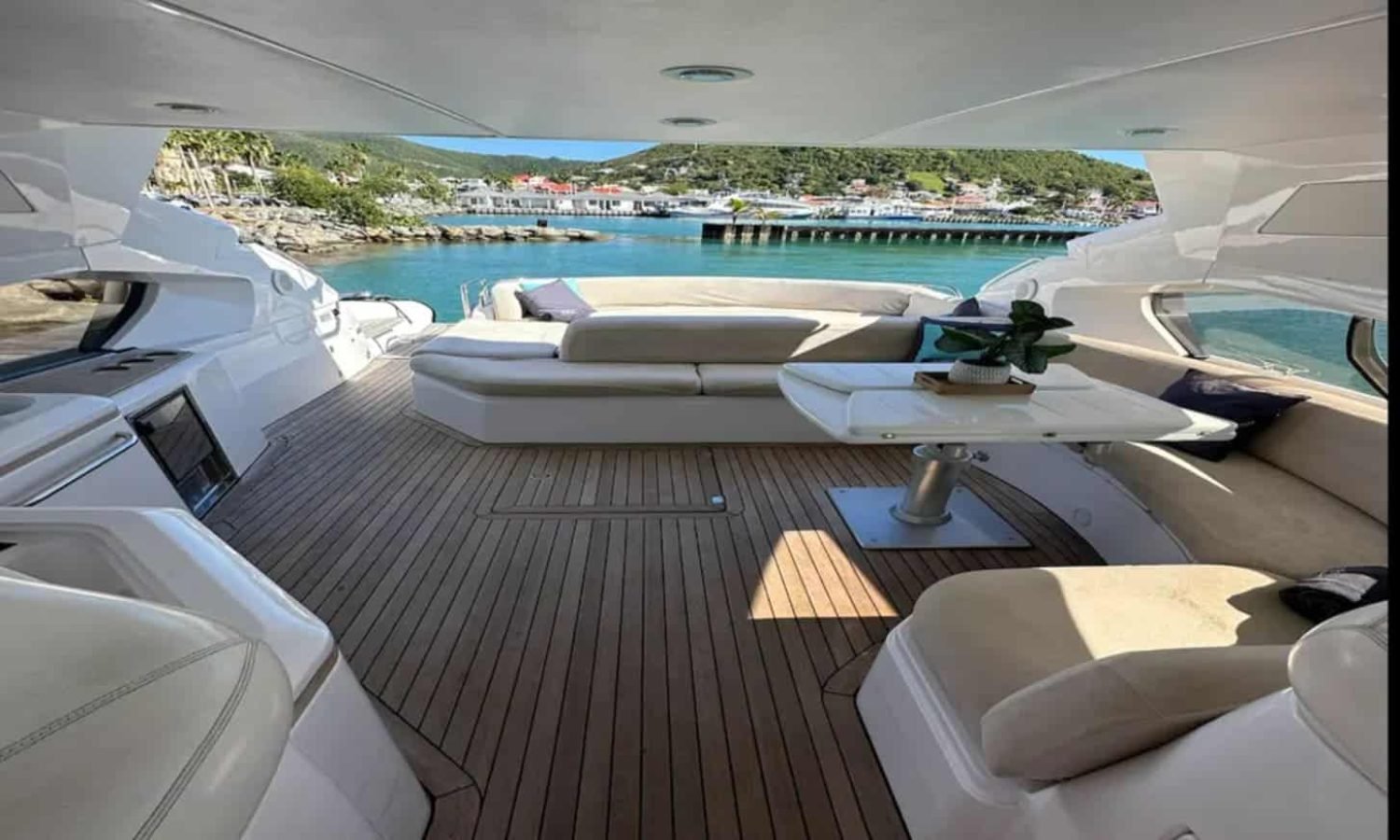 Luxurious salon of the 68' Sunseeker Predator featuring modern furnishings and panoramic windows.